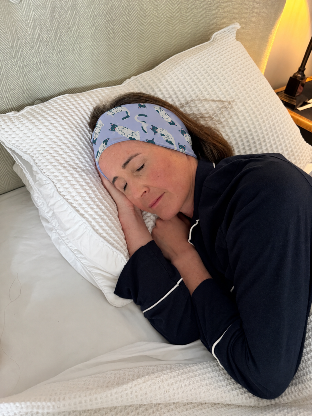 Kim asleep, wearing the lilac band